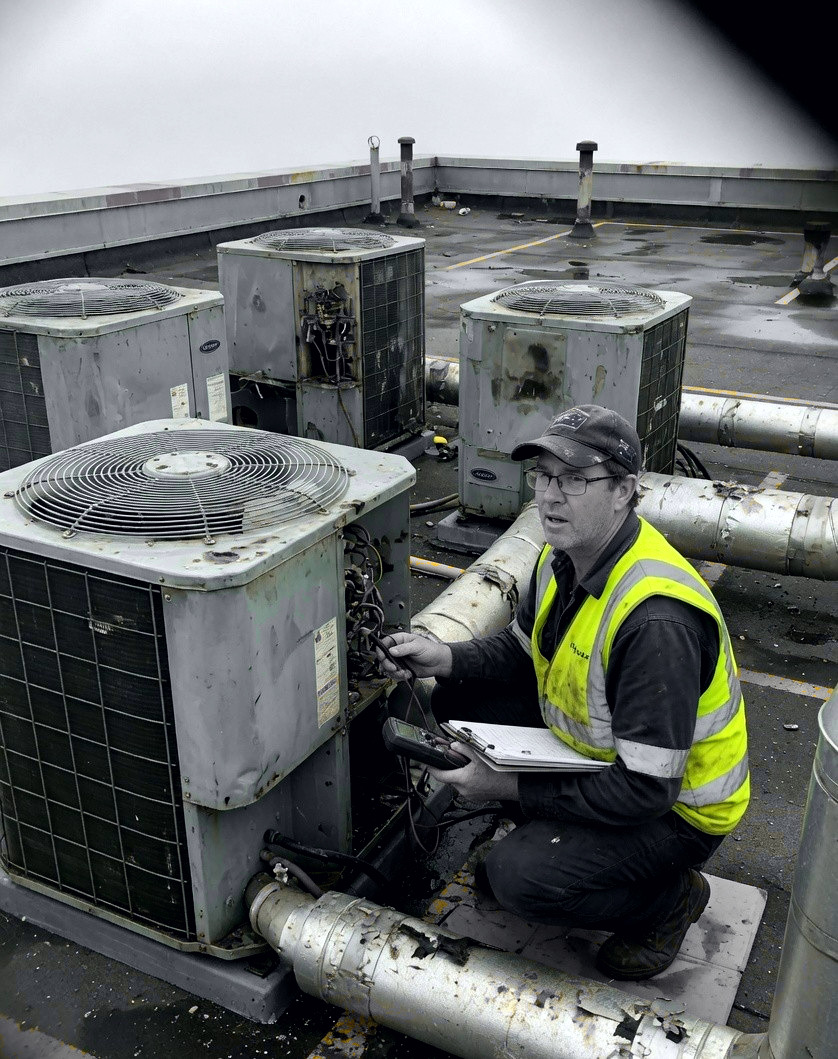 HVAC technician on a rooftop unit